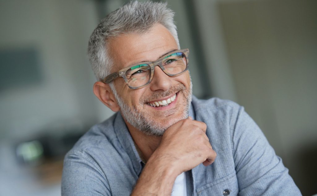 Smiling older man wearing glasses