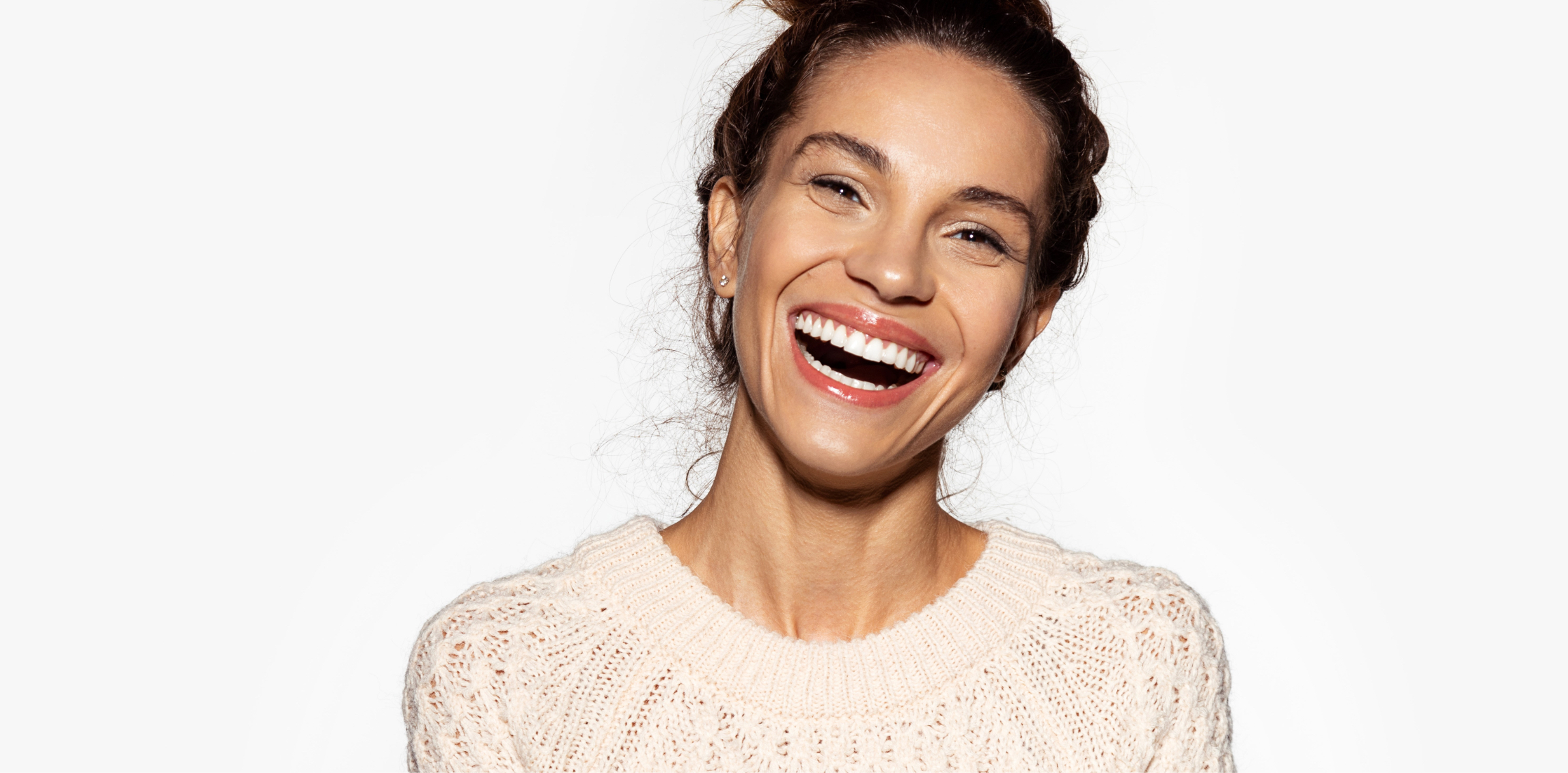 Happy woman in a white sweater