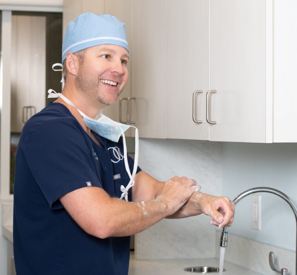 Dr. Connor washing his hands before surgery